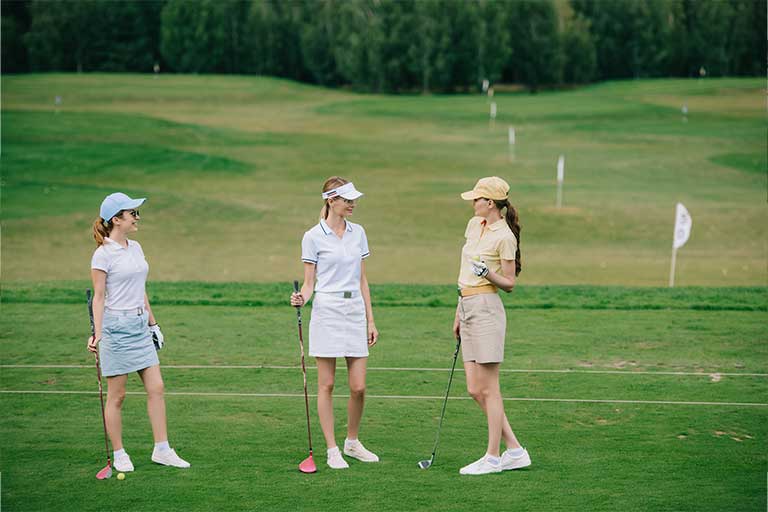 Best golf course for beginners in Louisiana 3 three women are standing on the golf course