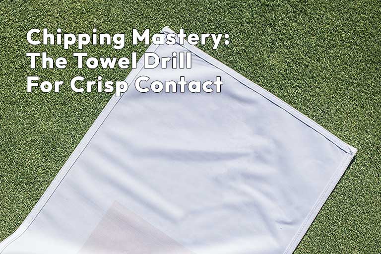 A white towel lies on a green grass surface with text overlay reading, "Chipping Mastery: The Towel Drill For Crisp Contact.