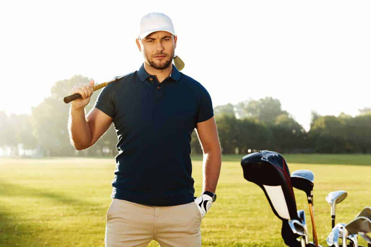 Golf Basics 6 a man holding a golf club in his right hand