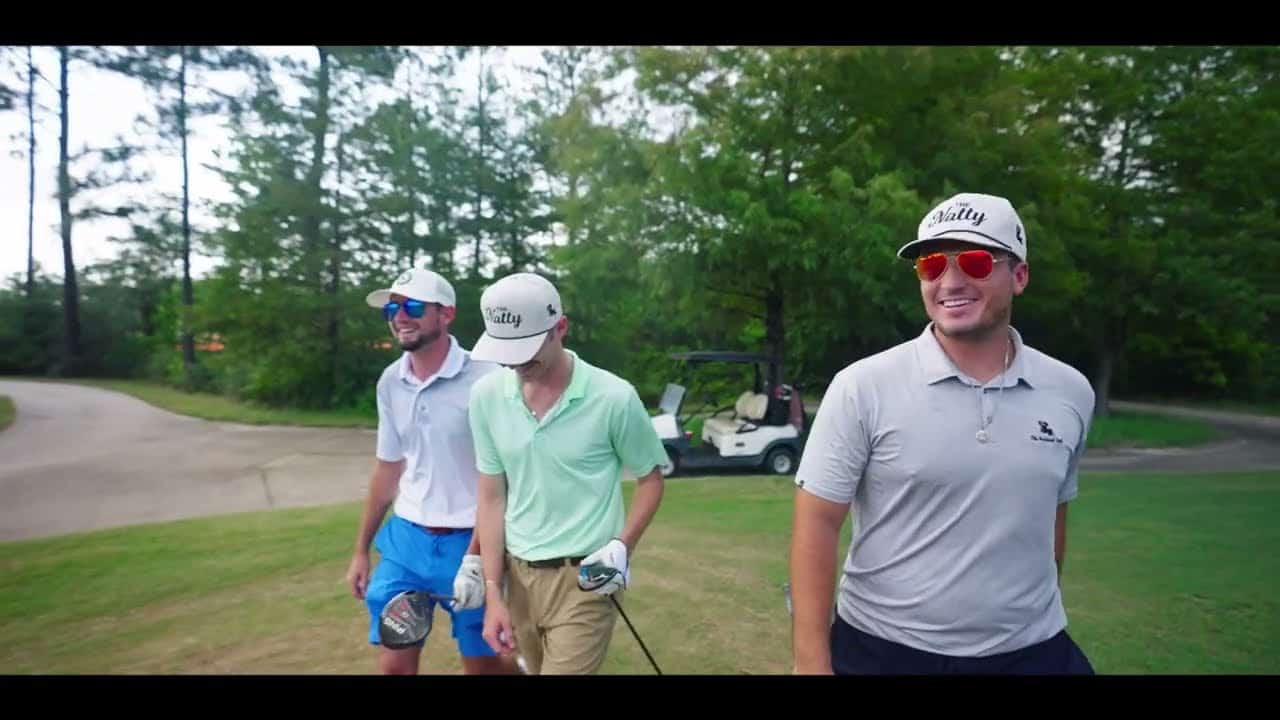 Golf Dress Code: What to Wear on the Golf Course 1 three men standing next to each other on a golf course